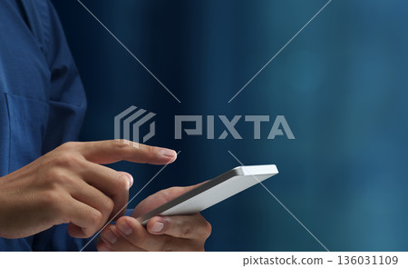 Man using smartphone. Close up of hand tapping on smartphone screen. Smart mobile device Man using smartphone. Close up of hand tapping on smartphone screen. Smart mobile device 136031109