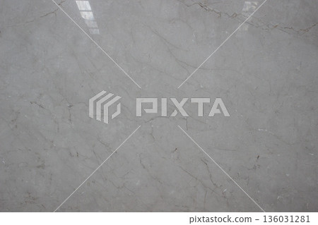 Crema Marfil marble texture with warm grey surface and thin scattered veins providing a clean impression. Crema Marfil marble texture with warm grey surface and thin scattered veins providing a clean impression. 136031281