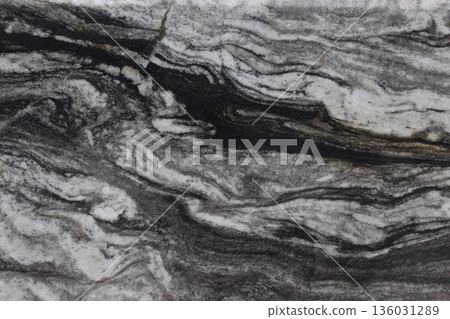 Detail of Copacabana granite marble texture with a blend of deep black and snow white forming an artistic pattern. Detail of Copacabana granite marble texture with a blend of deep black and snow white forming an artistic pattern. 136031289