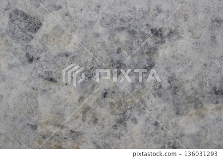 Detail of super white quartzite natural stone texture showing soft grey and white mineral crystal patterns Detail of super white quartzite natural stone texture showing soft grey and white mineral crystal patterns 136031293