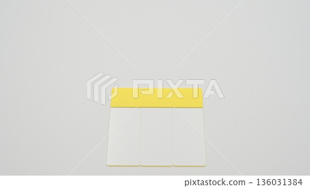 A standard-angle photograph of a glass slide placed vertically in the center of the bottom row on a white background 136031384