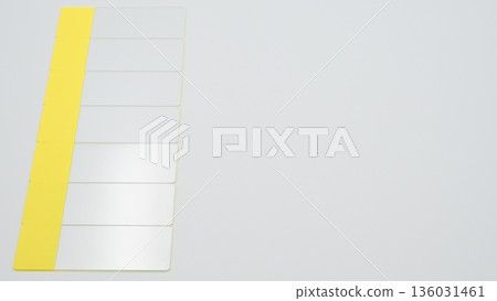 Seven standard-angle photographs of glass slides arranged horizontally on the left side of a white background 136031461