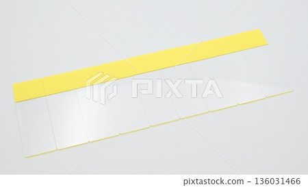 Nine standard-angle photographs of glass slides arranged diagonally upward to the right on a white background Nine standard-angle photographs of glass slides arranged diagonally upward to the right on a white background 136031466