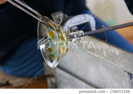 The glassblowing process in the workshop The glassblowing process in the workshop 136031506