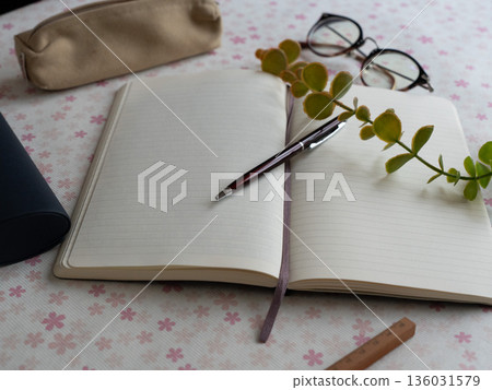 Notebook and pen in a spring atmosphere Notebook and pen in a spring atmosphere 136031579