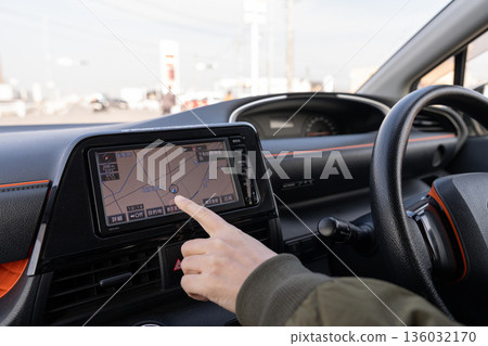 A person driving a car A person driving a car 136032170