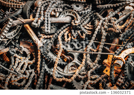 Rusty Industrial Chains and Gears in a Scrap Metal Pile, Detailed Close-Up of Corroded Mechanical Parts, Sprockets and Steel Components from an Abandoned Factory Recycling Yard. High quality photo Rusty Industrial Chains and Gears in a Scrap Metal Pile, Detailed Close-Up of Corroded Mechanical Parts, Sprockets and Steel Components from an Abandoned Factory Recycling Yard. High quality photo 136032371