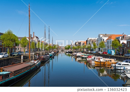 Picturesque Rotterdam Canal Scene with Boats and Historic Buildings in the Netherlands, Europe 136032423