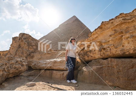Woman at the Giza Pyramid, Egypt, Travel and Ancient Wonders, Cultural Heritage Site Woman at the Giza Pyramid, Egypt, Travel and Ancient Wonders, Cultural Heritage Site 136032445