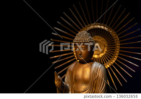 The upper body of a Buddha statue floating under a halo: silence and space 136032658