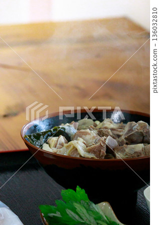 Steaming goat soup 136032810