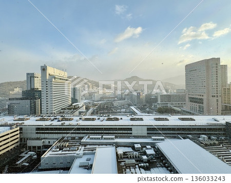 Snow falling at JR Hiroshima Station at dawn _ Snowy Hiroshima Station _ Winter _ Snow Scene Snow falling at JR Hiroshima Station at dawn _ Snowy Hiroshima Station _ Winter _ Snow Scene 136033243
