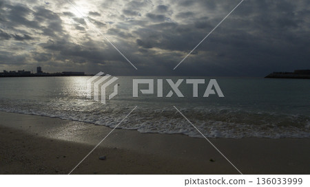 A cloudy evening, the calm sea of Ginowan Tropical Beach A cloudy evening, the calm sea of Ginowan Tropical Beach 136033999