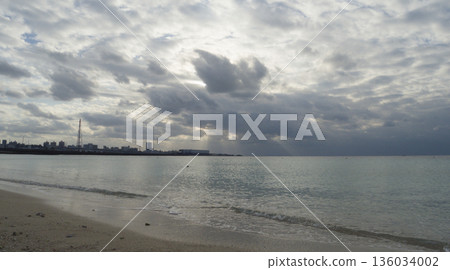 A cloudy evening, the calm sea of Ginowan Tropical Beach A cloudy evening, the calm sea of Ginowan Tropical Beach 136034002
