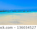 View of tropical sandy Nungwi beach and traditional wooden dhow boats in the Indian ocean on Zanzibar, Tanzania 136034527