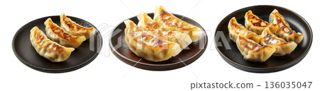 Golden pan-fried Japanese gyoza dumplings served on plate, isolated on white background, concept of Asian cuisine 136035047