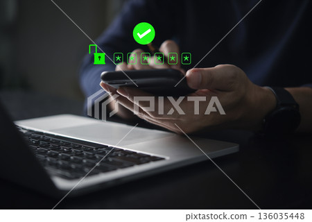 Authentication and secure login. A man is using his smartphone to verify a secure login with a one-time password (OTP) and a checkmark icon.concept two-factor authentication (2FA) and data security. 136035448