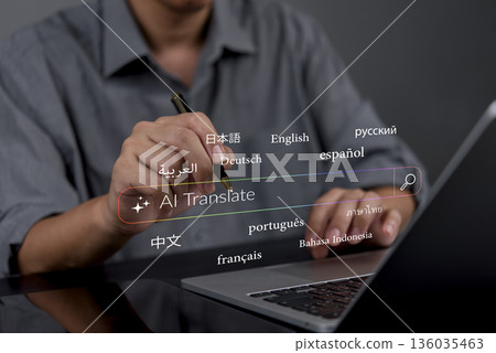 person in a modern workspace using a pen on a laptop, working with AI translation tools to translate text into languages like French, Spanish, and Japanese, promoting seamless global interaction. person in a modern workspace using a pen on a laptop, working with AI translation tools to translate text into languages like French, Spanish, and Japanese, promoting seamless global interaction. 136035463