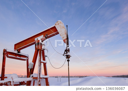 Snow Covered Oil Pumpjack at Winter Sunrise Snow Covered Oil Pumpjack at Winter Sunrise 136036087