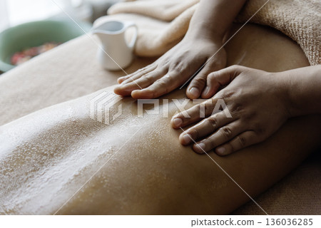 Thai massage Asian woman back side therapy relax treatment in spa salon. Spa body back pain massage. Woman happy relax skin lying spa bed use organic oil wellness body skincare. Spa salon therapist Thai massage Asian woman back side therapy relax treatment in spa salon. Spa body back pain massage. Woman happy relax skin lying spa bed use organic oil wellness body skincare. Spa salon therapist 136036285