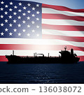 United States flag displayed behind a ship on water during sunset, showing national pride and maritime activity 136038072