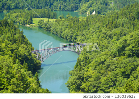 Kiha E120 local train crossing the Tadami River Bridge Kiha E120 local train crossing the Tadami River Bridge 136039622