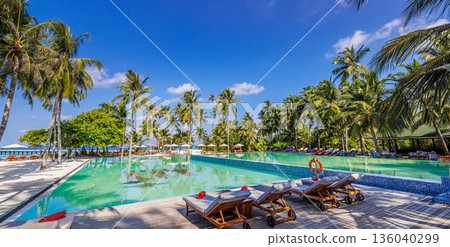 Panoramic infinity pool luxury beach resort view with palm trees sun loungers turquoise ocean horizon tropical summer paradise background 136040299