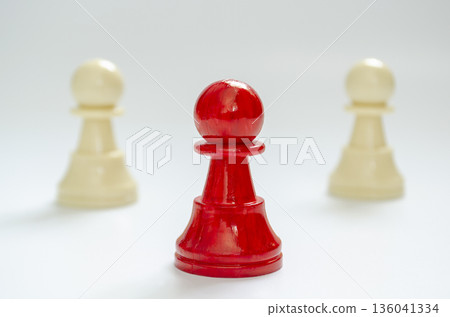 Standing red pawn positioned forward representing frontline leadership Standing red pawn positioned forward representing frontline leadership 136041334