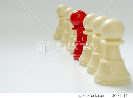 Red pawn stood out from the rest of the pawns representing courage to speak up concept Red pawn stood out from the rest of the pawns representing courage to speak up concept 136041341