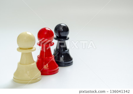 Pawns in black, red and white representing diversity, inclusion and equity with customizable space for text 136041342