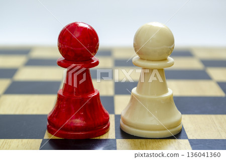 Standing mixed pawns representing unity and tension within diversity. Standing mixed pawns representing unity and tension within diversity. 136041360