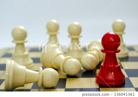 Red pawn under observation among white pawns representing bias and surveillance. 136041361