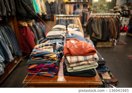 Vintage men's clothing store interior with different kinds of apparel and accessories on display. Vintage men's clothing store interior with different kinds of apparel and accessories on display. 136041985