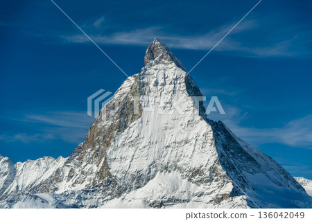 Snowy mountain scenery with Matterhorn and blue sky Snowy mountain scenery with Matterhorn and blue sky 136042049
