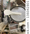 Disorganized kitchen and scattered cooking utensils 136042801