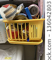 Daily necessities placed on a home storage shelf 136042803