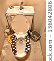 A living-like interior with a tank toilet with hand washing function and a toilet seat cover 136042806