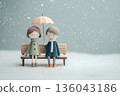 A gentle moment between two people on a bench sharing an umbrella on a rainy day 136043186