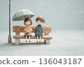 A gentle moment between two people on a bench sharing an umbrella on a rainy day 136043187