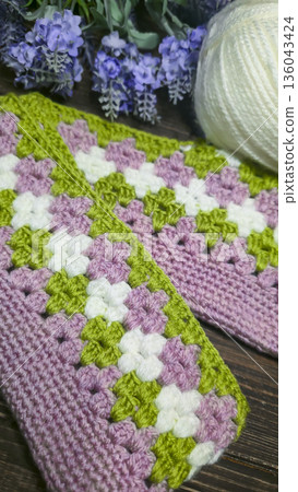 A colorful knitted fabric texture suitable for home decor, fashion, or textile A colorful knitted fabric texture suitable for home decor, fashion, or textile 136043424