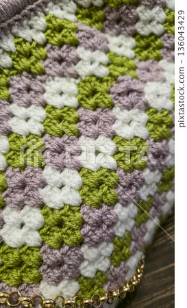 A colorful knitted fabric texture suitable for home decor, fashion, or textile A colorful knitted fabric texture suitable for home decor, fashion, or textile 136043429