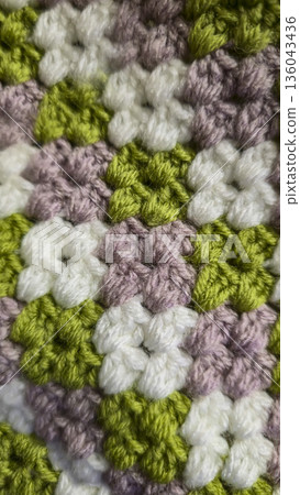A colorful knitted fabric texture suitable for home decor, fashion, or textile A colorful knitted fabric texture suitable for home decor, fashion, or textile 136043436