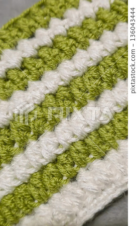 A colorful knitted fabric texture suitable for home decor, fashion, or textile A colorful knitted fabric texture suitable for home decor, fashion, or textile 136043444