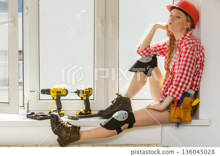 Girl using some power tools for work at home 136045028