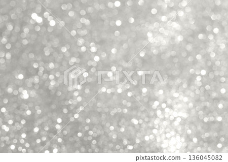 Shimmering silver bokeh background with glittery lights for celebration and stylish decor Demonstration Color of the Year 2026 136045082