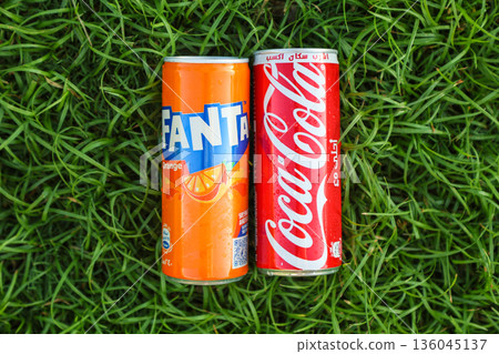 Egypt, Sharm El Sheikh - September 27, 2025 Two cans of popular carbonated drinks Coca-Cola and Fanta on a beautiful summer background. Editorial 136045137
