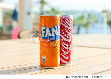 Egypt, Sharm El Sheikh - September 27, 2025 Two cans of popular carbonated drinks Coca-Cola and Fanta on a beautiful summer background. Editorial 136045138