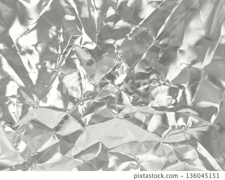 Crumpled aluminum foil texture with reflective silver surface Demonstration Color of the Year 2026 136045151