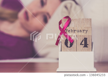 Woman on bed, world breast cancer day on calendar Woman on bed, world breast cancer day on calendar 136045233