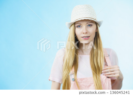 Happy woman wearing summer outfit Happy woman wearing summer outfit 136045241